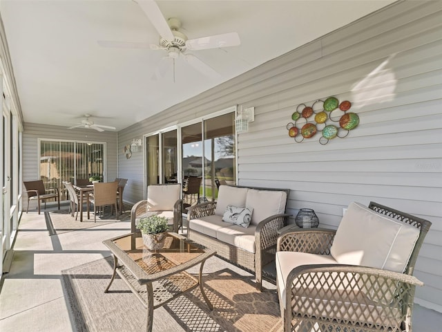 sunroom featuring ceiling fan