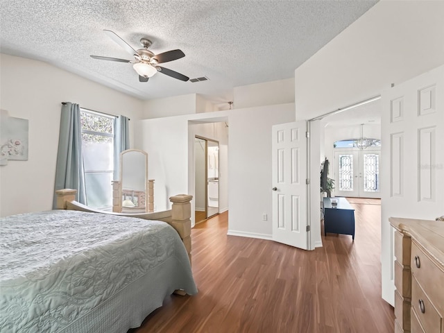 bedroom featuring a textured ceiling, french doors, wood finished floors, and a ceiling fan