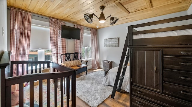 bedroom featuring wooden ceiling and wood finished floors