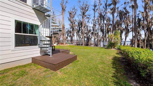 view of yard featuring stairway and a deck