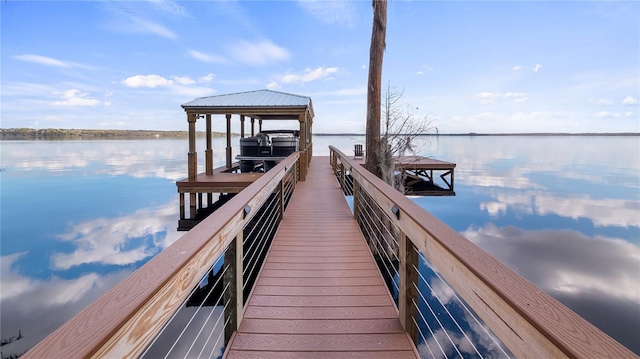 dock area with a water view