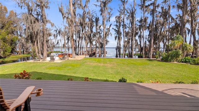 12117 Cypress Ln, Clermont, FL 34711 - wooden terrace featuring a water view and a lawn