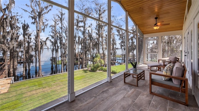 12117 Cypress Ln, Clermont, FL 34711 - sunroom / solarium featuring a water view, ceiling fan, wood ceiling, lofted ceiling, and floor to ceiling windows