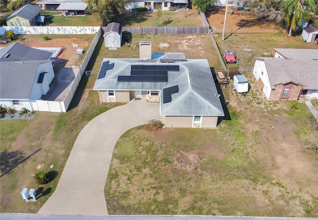 birds eye view of property with a residential view