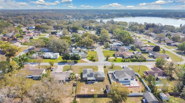 bird's eye view with a residential view and a water view