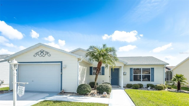 single story home with a front yard, driveway, and an attached garage