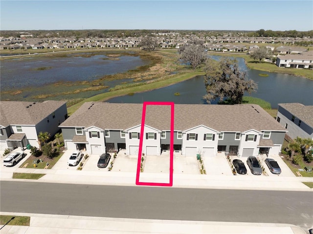 aerial view featuring a residential view and a water view