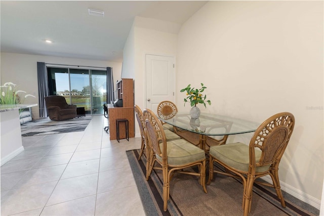 dining room featuring visible vents, baseboards, and light tile patterned floors