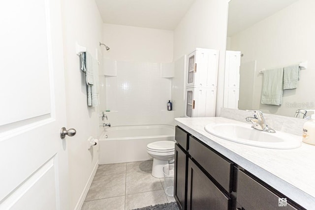 bathroom featuring bathtub / shower combination, toilet, vanity, tile patterned flooring, and baseboards