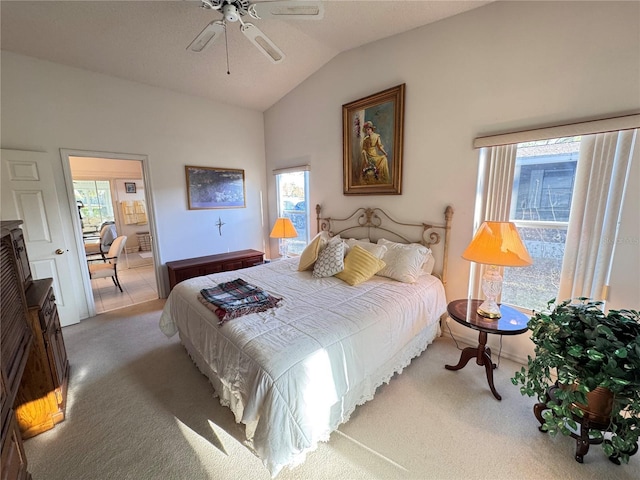 bedroom featuring lofted ceiling, ceiling fan, and carpet flooring