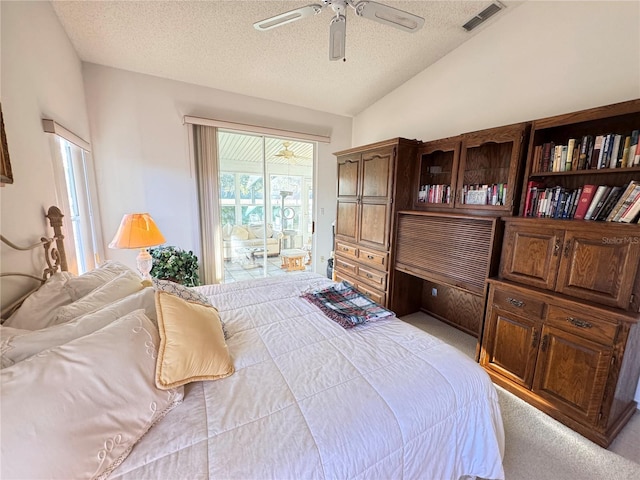 carpeted bedroom featuring visible vents, a ceiling fan, vaulted ceiling, a textured ceiling, and access to outside