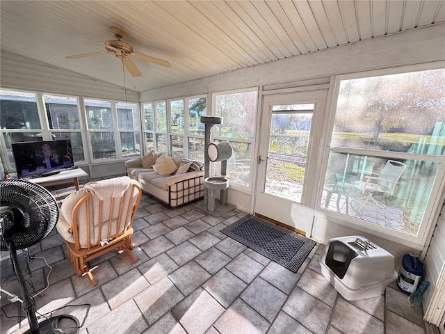 sunroom / solarium featuring a ceiling fan, wood ceiling, and vaulted ceiling