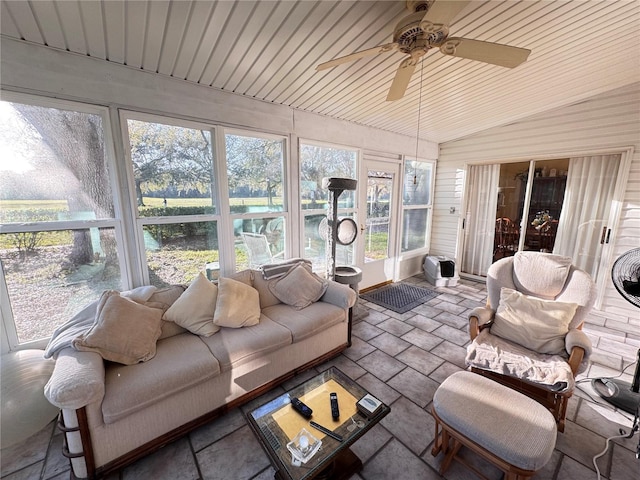 sunroom / solarium with vaulted ceiling, wooden ceiling, and a ceiling fan