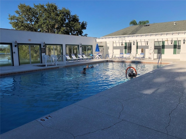 community pool featuring a patio