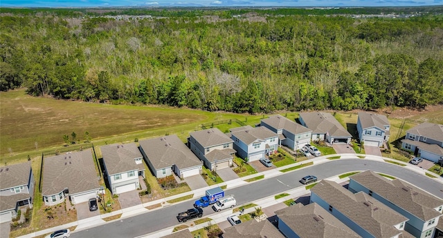 aerial view with a residential view and a wooded view