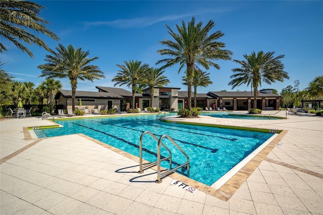 community pool featuring a patio area