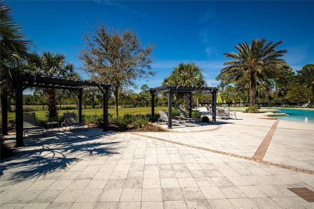 view of jungle gym with a patio area, a community pool, and a pergola