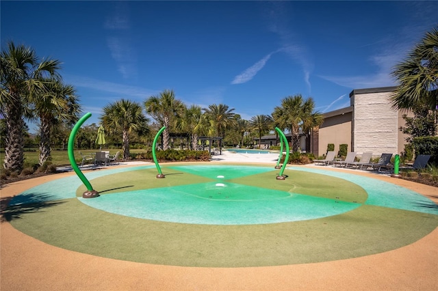 view of property's community featuring a patio and a swimming pool