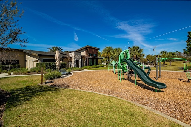 community playground featuring a lawn