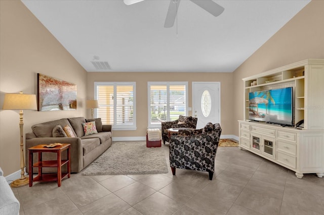 living room with lofted ceiling, light tile patterned floors, baseboards, and visible vents