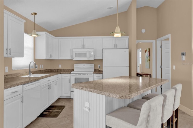 kitchen featuring white appliances, lofted ceiling, pendant lighting, a sink, and light tile patterned flooring