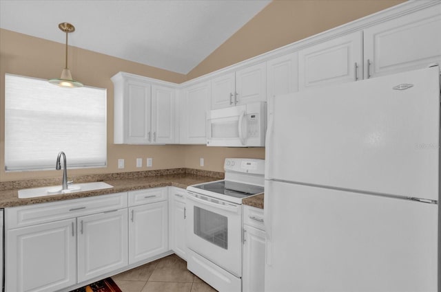 kitchen featuring lofted ceiling, white appliances, a sink, and white cabinetry