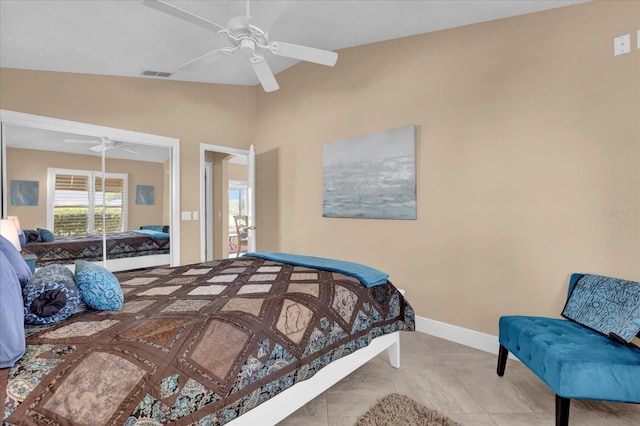 tiled bedroom featuring baseboards, visible vents, vaulted ceiling, and a ceiling fan