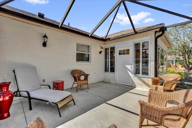 view of patio / terrace with a lanai