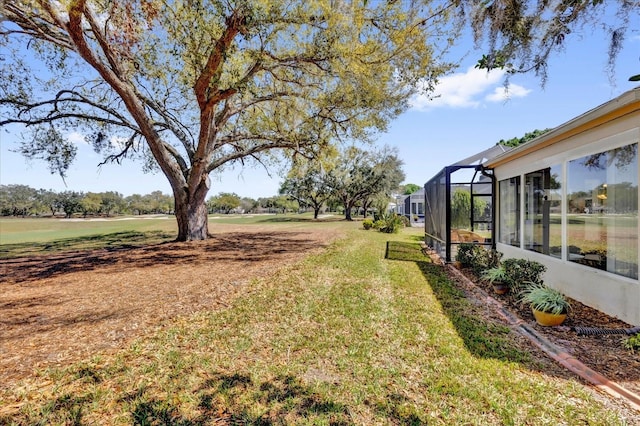 view of yard with a lanai