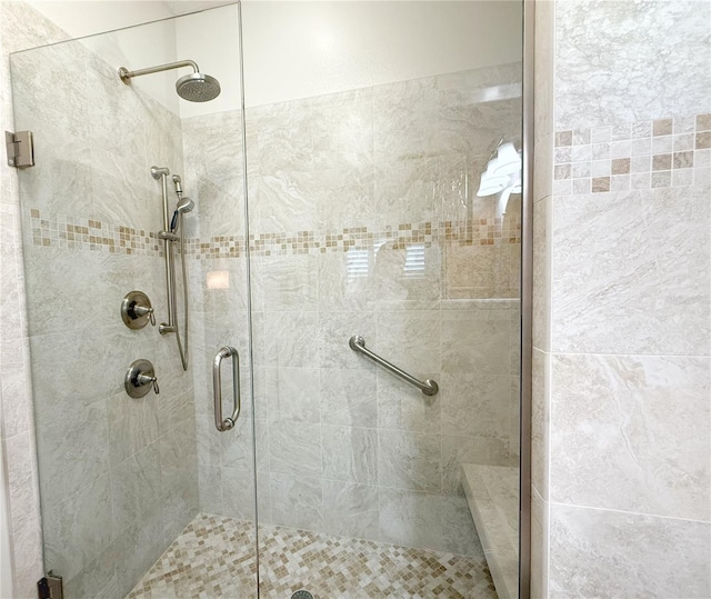 full bath with a shower stall