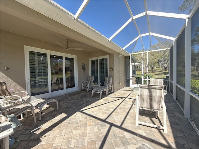 exterior space with a lanai and ceiling fan