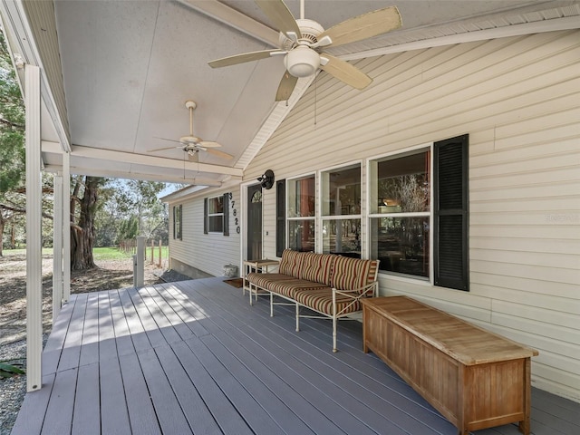 wooden deck featuring ceiling fan