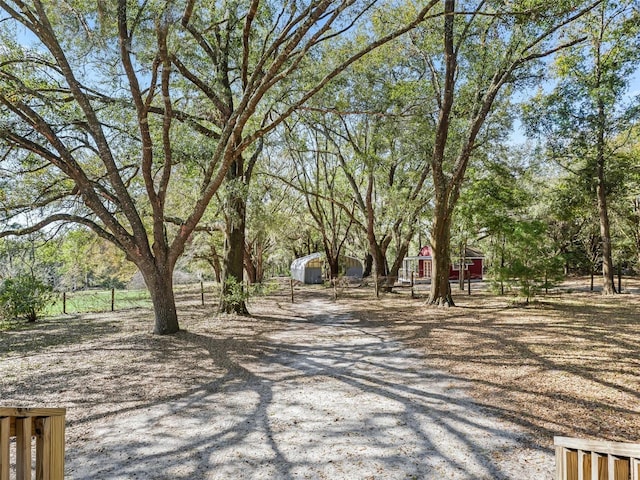 exterior space with dirt driveway