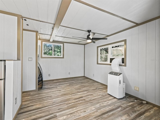 interior space featuring ceiling fan and wood finished floors