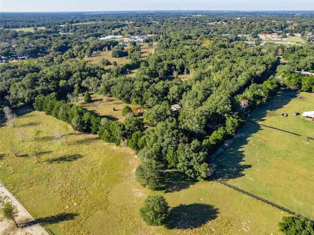 drone / aerial view featuring a view of trees