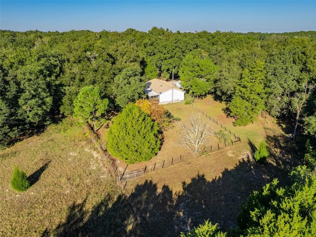 aerial view featuring a wooded view