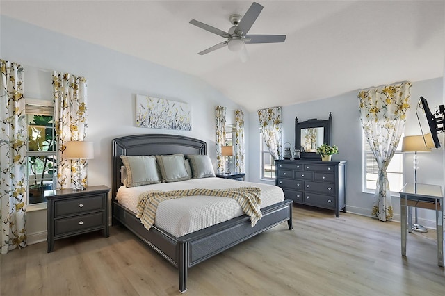 bedroom with baseboards, wood finished floors, a ceiling fan, and vaulted ceiling