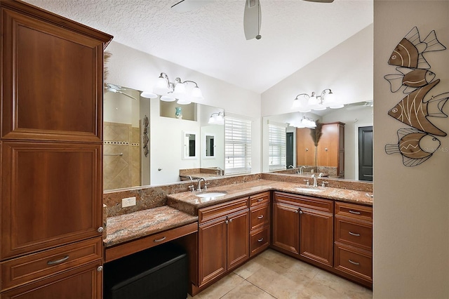 full bathroom with tile patterned flooring, ceiling fan, lofted ceiling, and a sink