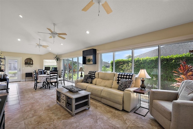 living room featuring recessed lighting and lofted ceiling