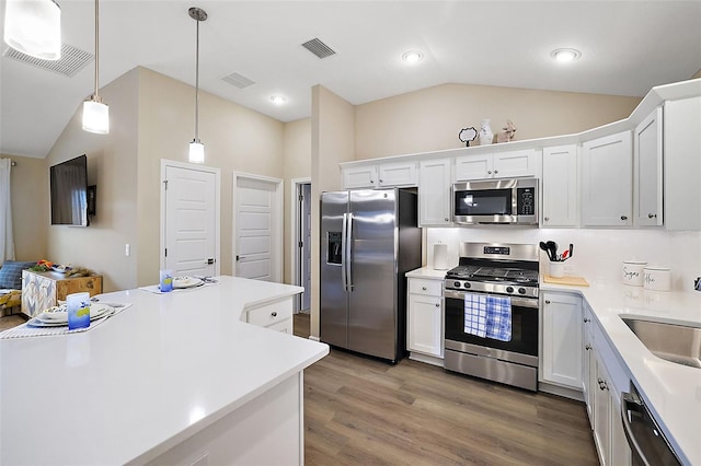 kitchen featuring visible vents, stainless steel appliances, and light countertops