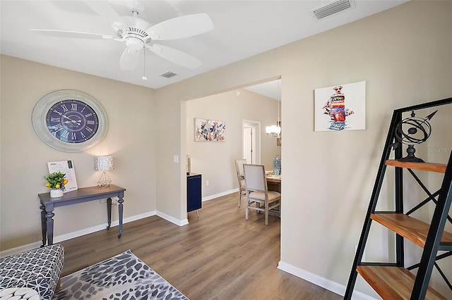 interior space featuring visible vents, baseboards, and wood finished floors