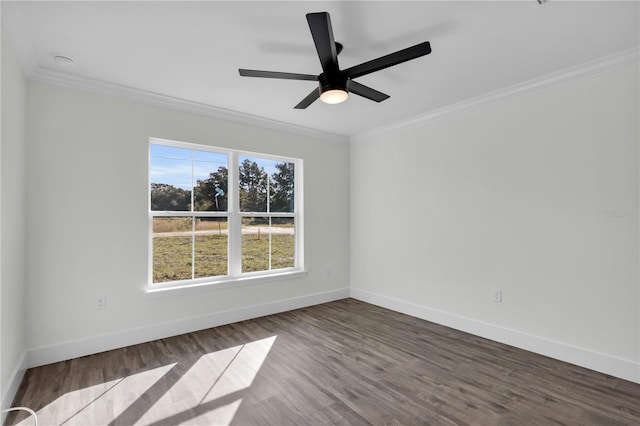 empty room featuring dark wood-style floors, baseboards, a ceiling fan, and crown molding