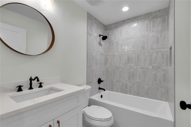 bathroom featuring shower / bathing tub combination, vanity, and toilet