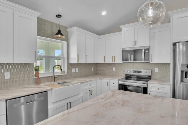 13334 SW 107th St, Dunnellon, FL 34432 - kitchen with appliances with stainless steel finishes, white cabinets, and tasteful backsplash