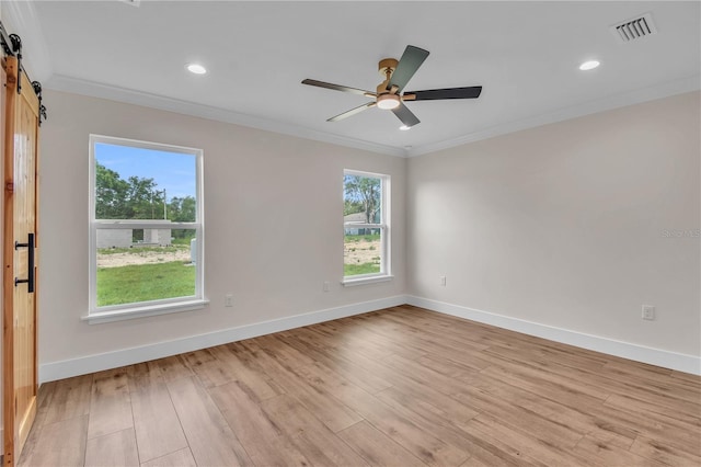 13334 SW 107th St, Dunnellon, FL 34432 - unfurnished room with a barn door, crown molding, light wood-type flooring, a ceiling fan, and recessed lighting