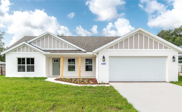 13334 SW 107th St, Dunnellon, FL 34432 - view of front of home with a shingled roof, a front lawn, concrete driveway, an attached garage, and stucco siding