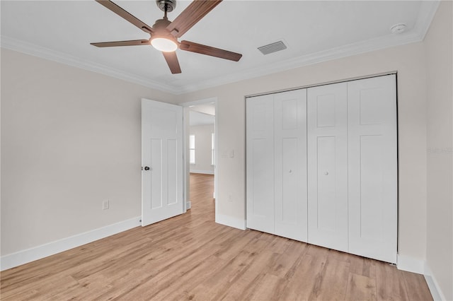 13334 SW 107th St, Dunnellon, FL 34432 - unfurnished bedroom featuring ornamental molding, light wood finished floors, a closet, and ceiling fan