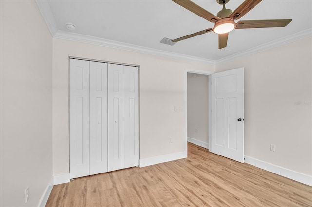 13334 SW 107th St, Dunnellon, FL 34432 - unfurnished bedroom featuring crown molding, light wood-style flooring, a closet, and ceiling fan