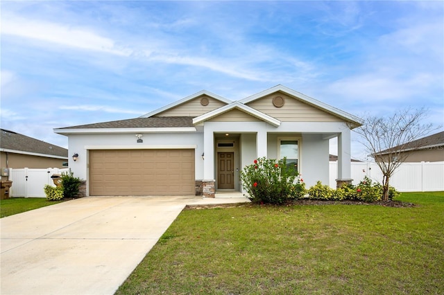 view of front of house with a garage, concrete driveway, a front yard, and fence