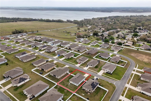 bird's eye view featuring a residential view and a water view